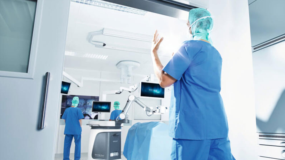 A surgeon walks into the OR to perform surgery with the Aesculap Aeos®. 